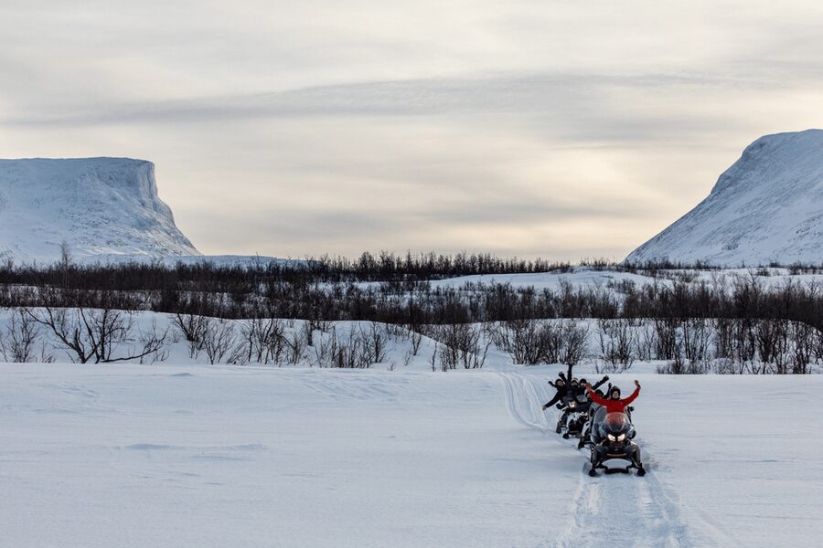 Abisko: Great Outback Snowmobile Tour with Lake Abiskojaure - Picking up in Abisko, then getting suited up for real cold