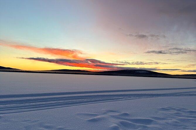 Day tour with snowmobile in Kiruna 10:30 am - Swedish fika mid-tour: warm lingonberry juice and bakery sweets