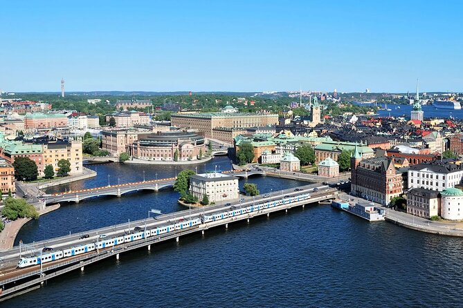 Stockholm's Best Bike Tour! - Past Parliament and City Hall, with lake Mälaren in the frame